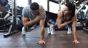 Toning Bingo Wings: Your Ultimate Guide to Sculpting Sleek Arms at the Gym 3 Fitness trainer demonstrating arm toning exercises Willenhall